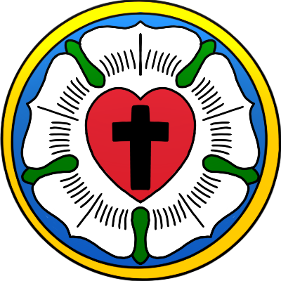 The Luther Rose, an emblem of a 5 pointed white rose with green leaves and a red heart with a black cross in the centre. The rose is in a blue disc with a gold surround. the emblem has a gradient